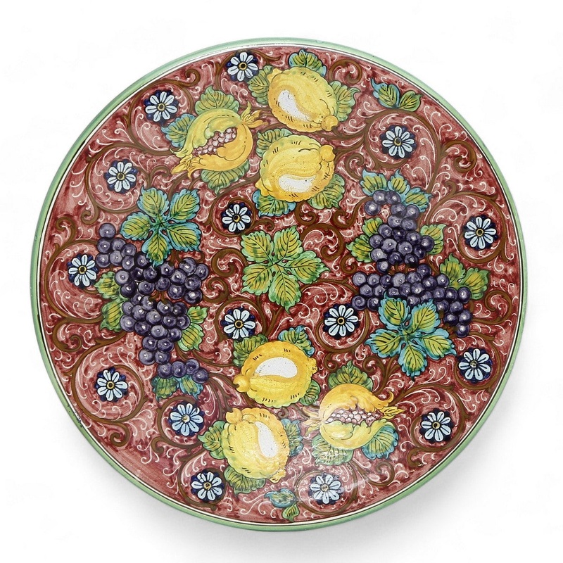 TUSCAN MAJOLICA: Large wall plate featuring Grapes, Pomegranate and Lemons on a Red Rubino rich design. (20.5″ DIAM)
