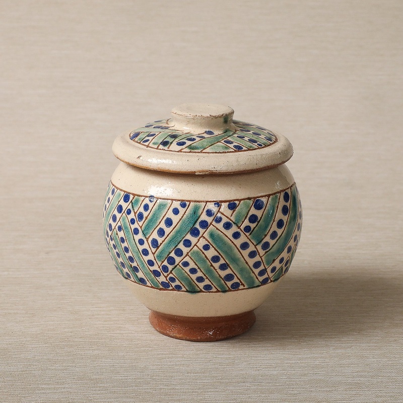 Canister with hand painted papyrus decoration